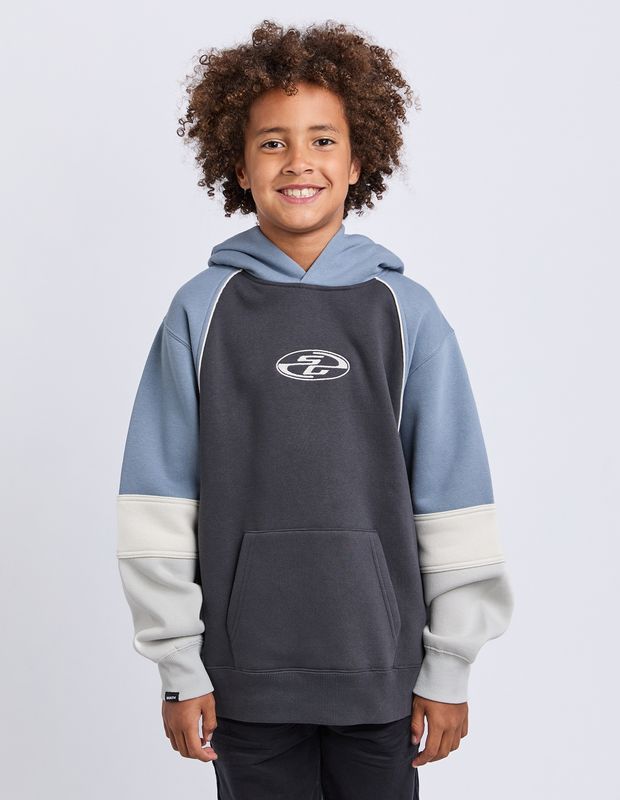 Teen Model wearing the St Goliath Quantum Hoodie in charcoal with cream and blue paneling 