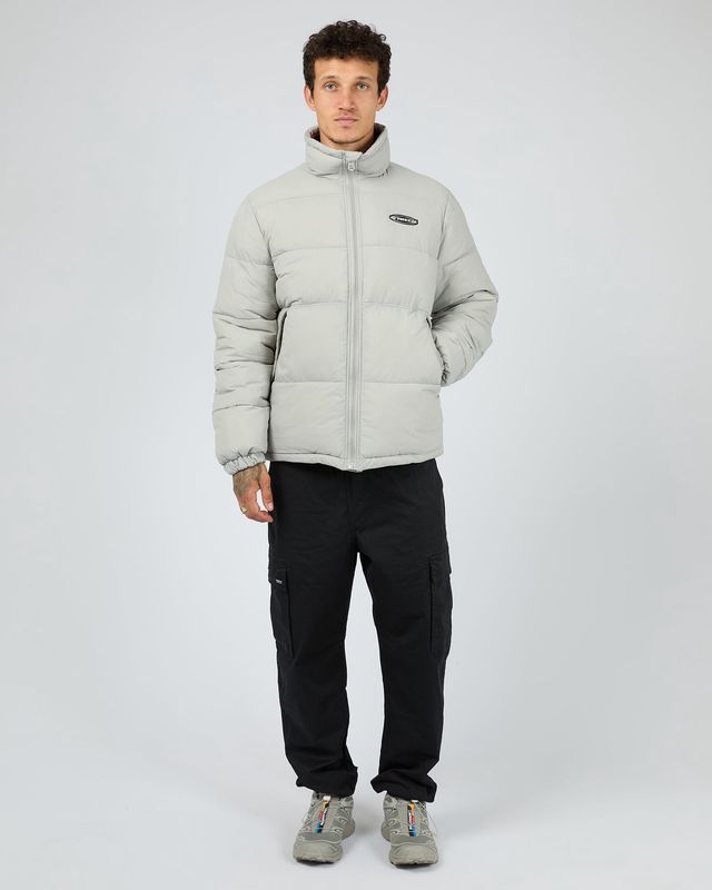 full body male model wearing the St Goliath Gravity Jacket featuring a full size zip and cuffed sleeves 

