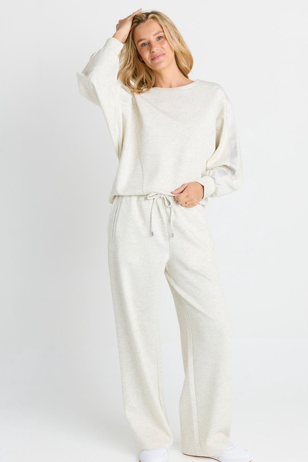 Women wearing the Betty Basic Marcy Trackpant in grey marle a soft and stretching trackpant in a wide leg fit 
