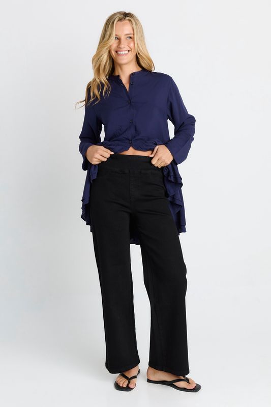 A female model wearing the Straight Stretch jean in black featuring a high waist look and the sleek black wash colour 