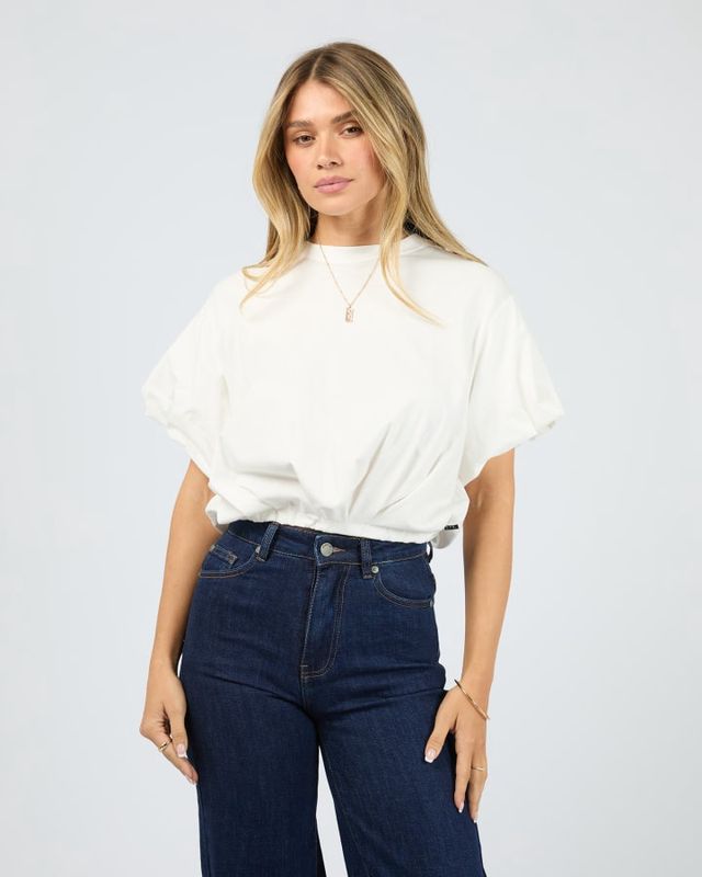 Model wearing the AAE Icon Bubble Tee in Vintage white. A t-shirt with cuffed sleeves and elastic waistband for bubble look