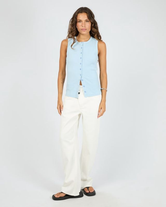 Full view of wome wearing the Silent Theory Button Up Tank. Featuring buttons down the centre and in a baby blue colour