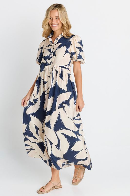 A female model wearing the Nova Shirt Dress showing the flowingness and puff sleeves.