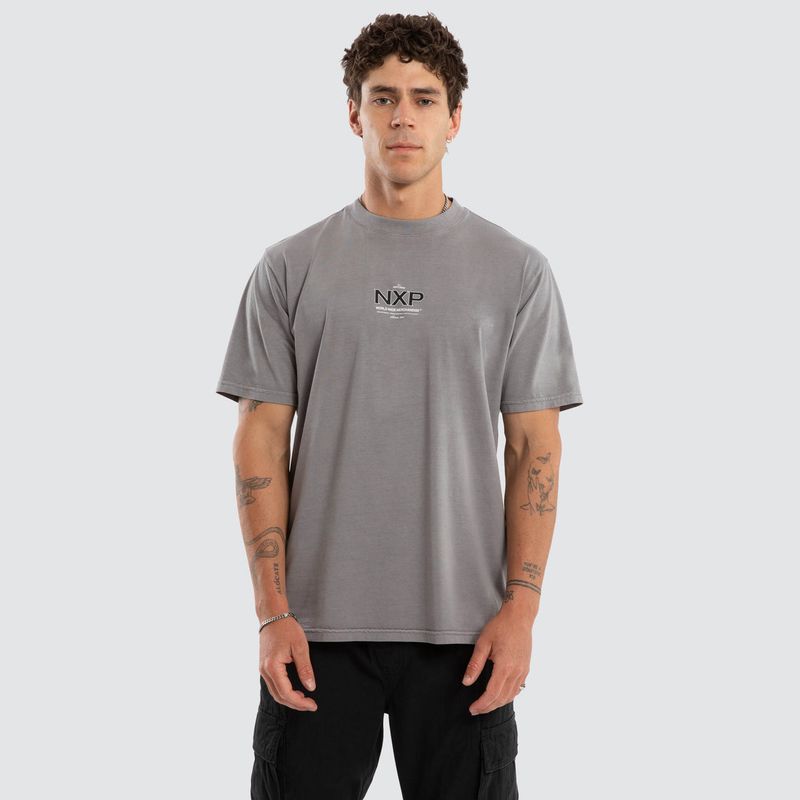 A male model wearing the Cendra Classic Tee, featuring  a grey colour, mid length and a flowy fit.