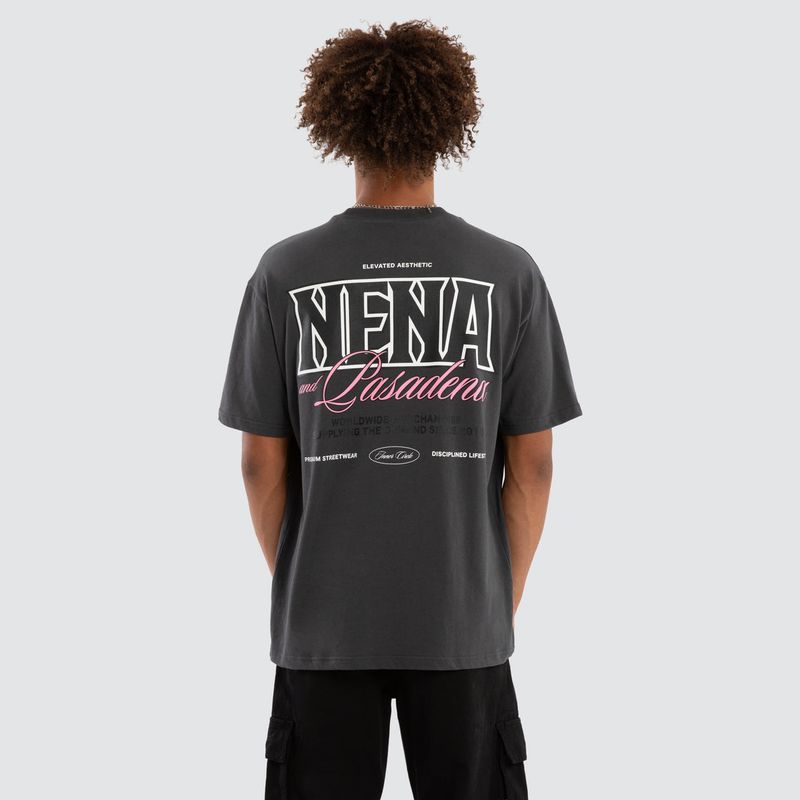 A male model wearing the Maurosa Box Fit Tee, featuring a bold NENA logo with pink writing on the back.