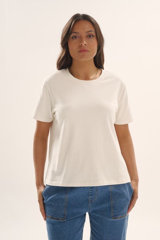 A female model wearing the Betty Basics Base Tee in White showing the fit and mid length. 