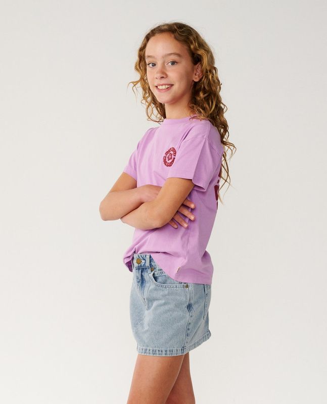A girl model wearing the Girls Surf Puff Relaxed Tee [8-16YEARS] featuring the medium weight material.