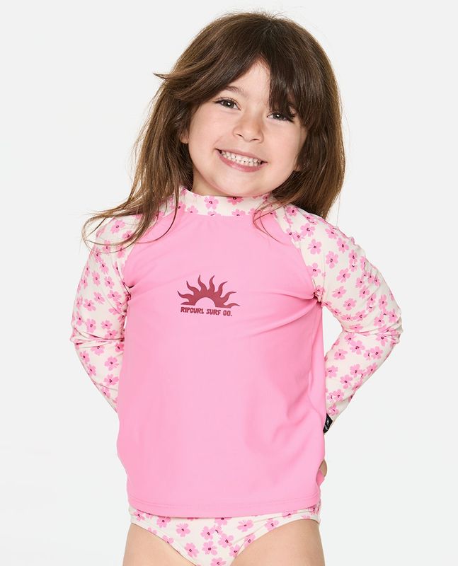 A girl model wearing the Party Wave 2 Piece Set [1-8YEARS] featuring a small Rip Curl logo with a sun on the front.