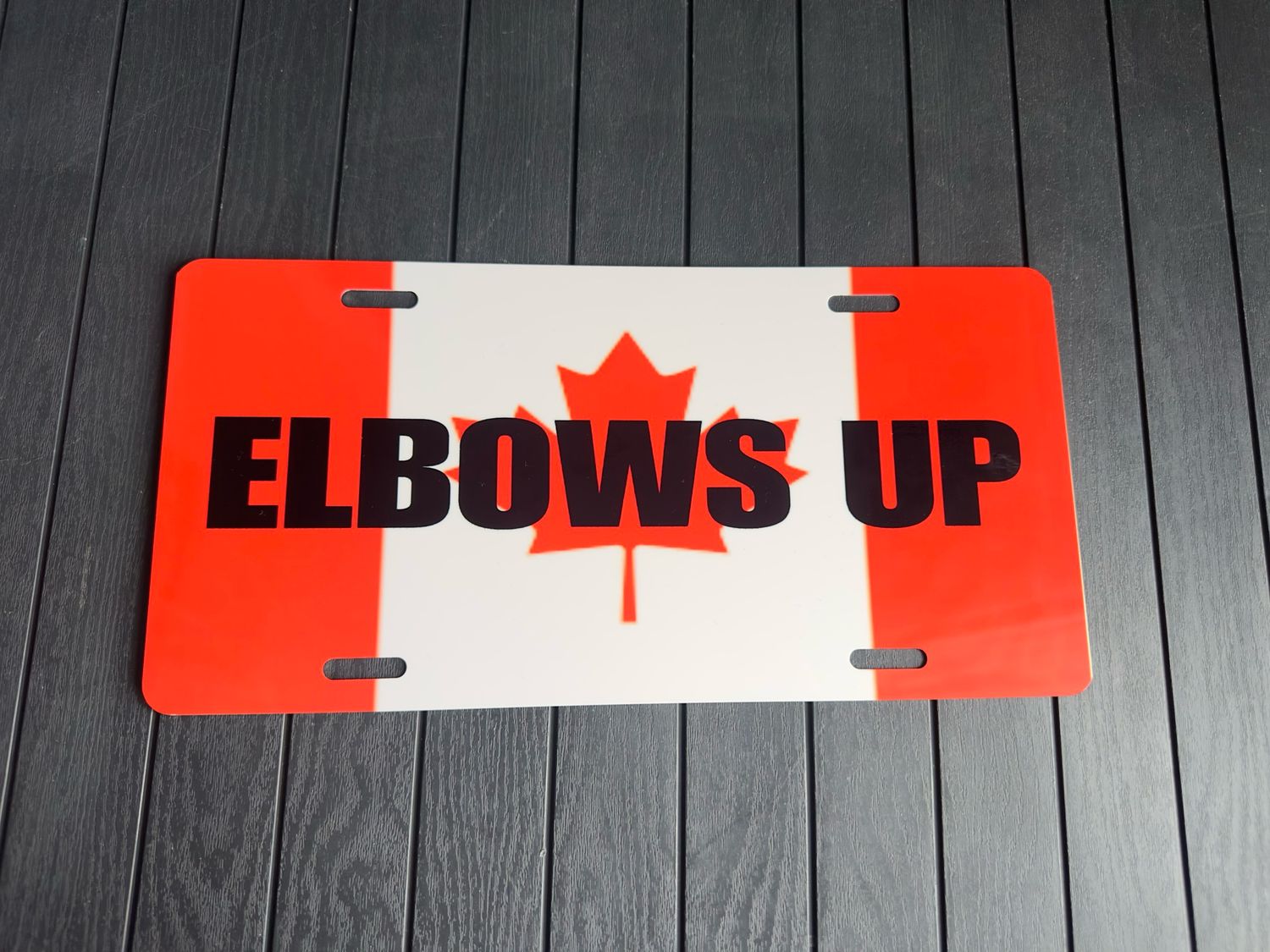Elbows Up License plate