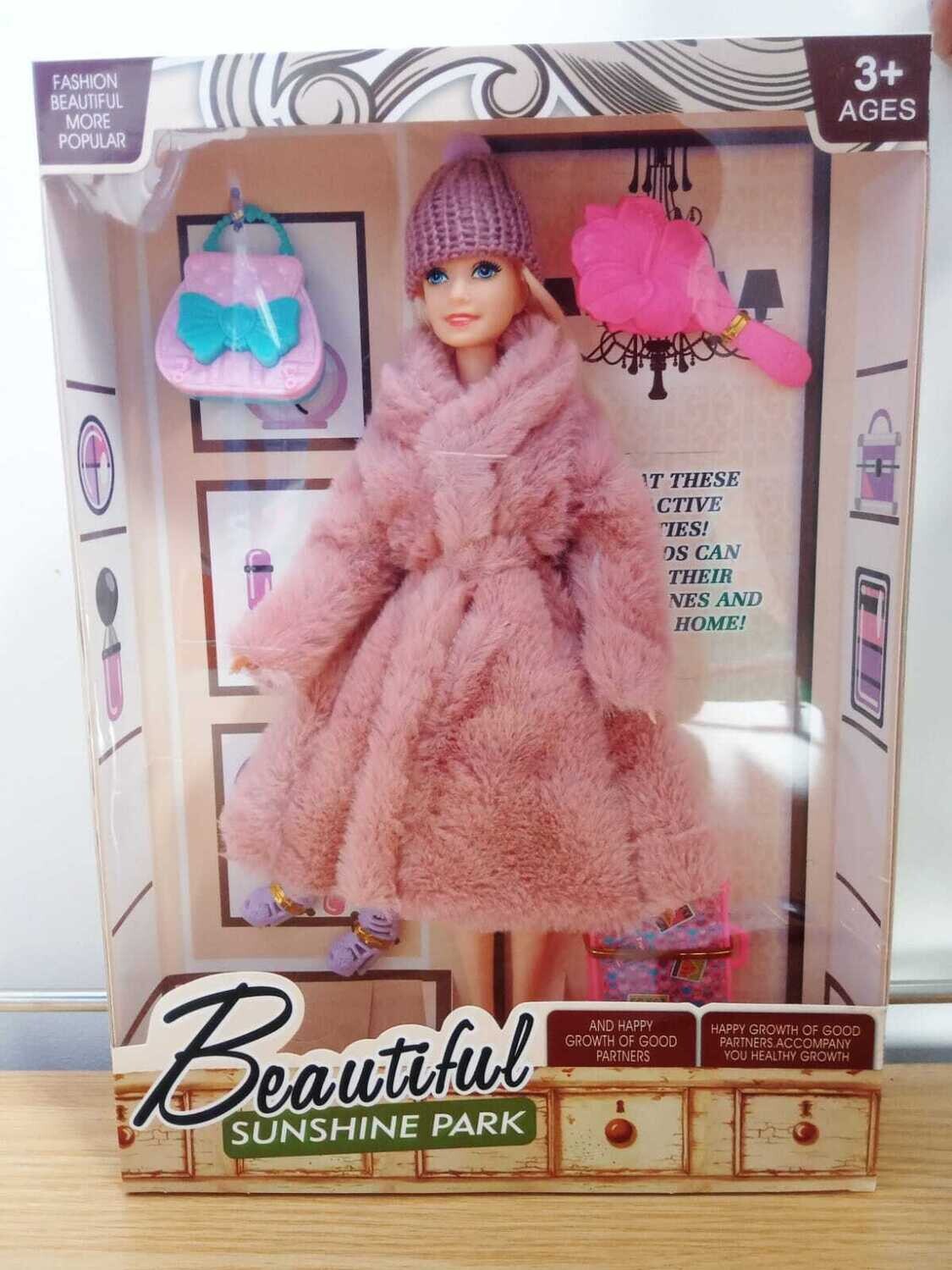 Muñeca con tapado