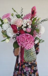 Florist choice seasonal blooms in a glass vase