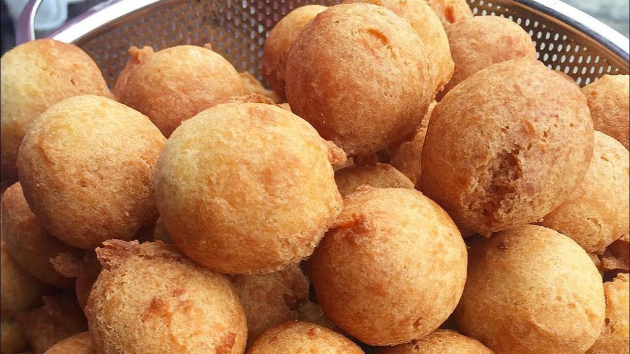 Golden, freshly fried Nigerian Buns, crisp on the outside with a soft, sweet interior—perfect for any occasion or snack.