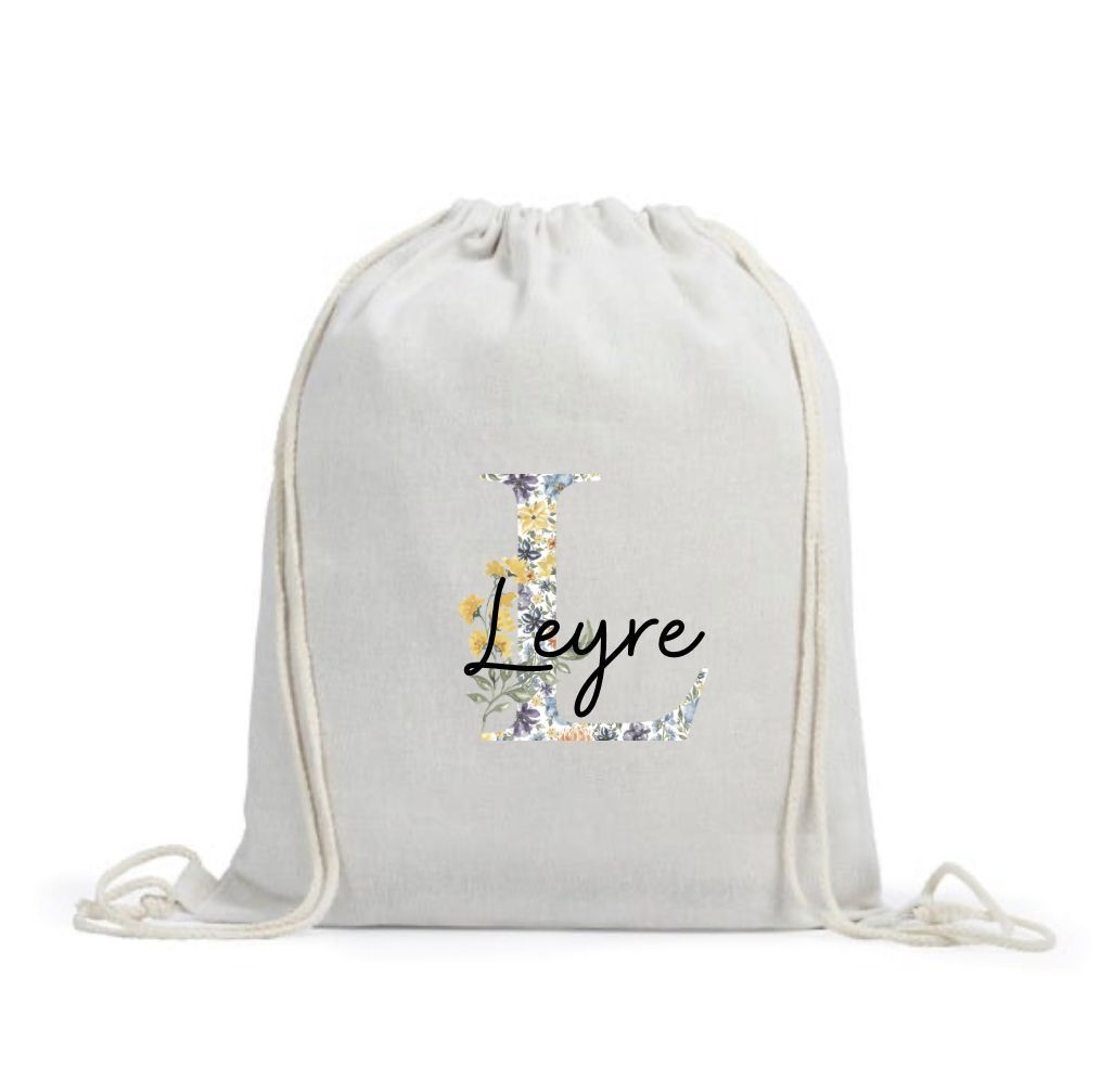 MOCHILA INICIAL FLORAL + NOMBRE