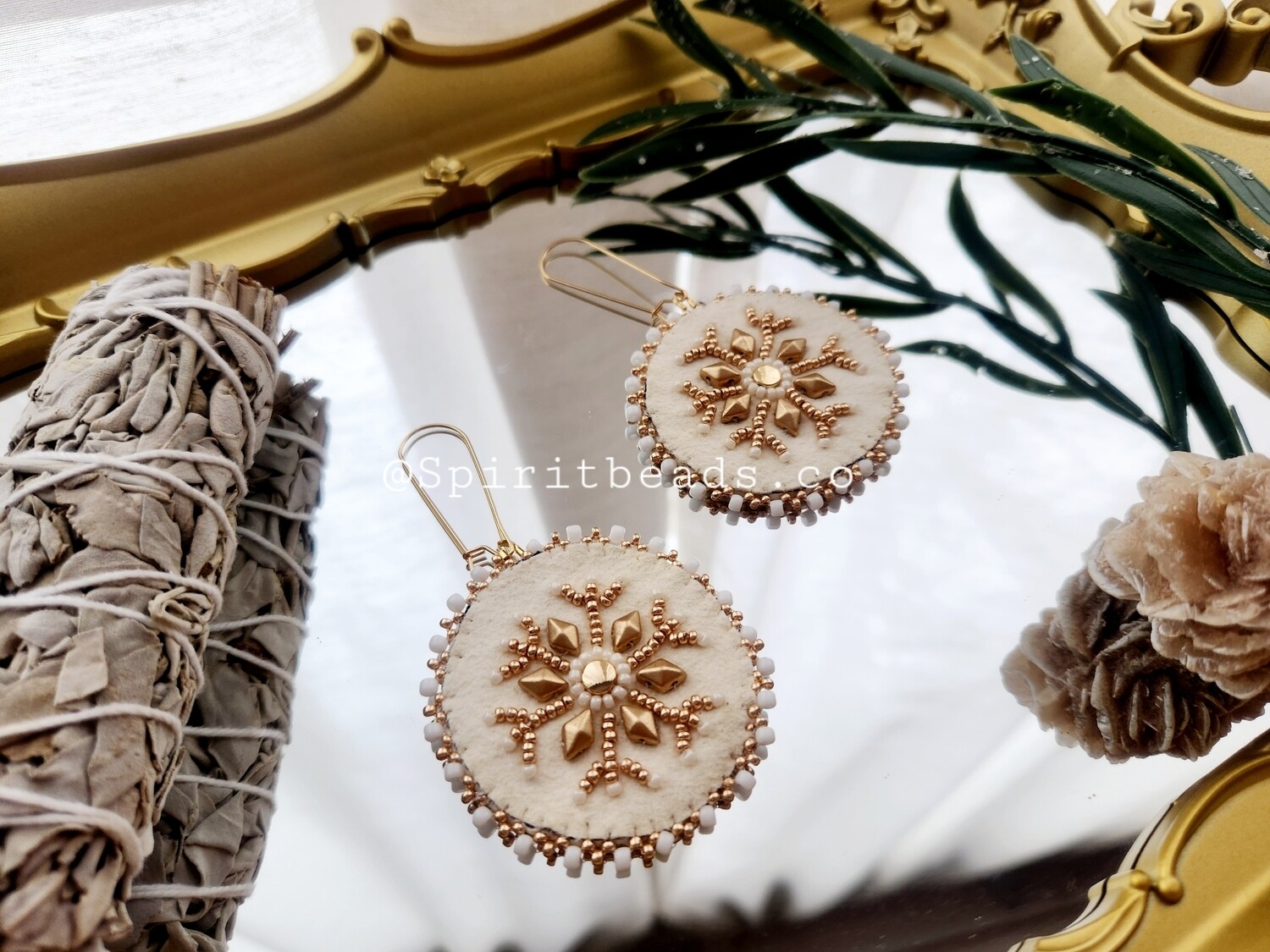 White buckskin 24k snowflake earrings