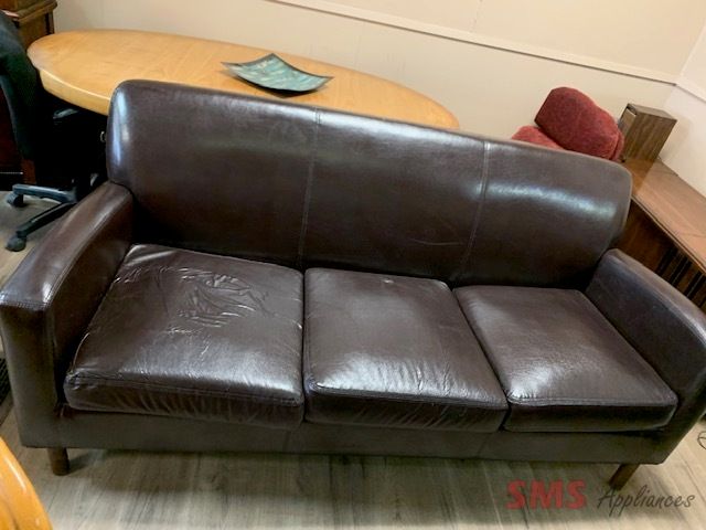 Brown  three seats couch. Dimensions: 
H- 35”, W- 73”, D- 31”