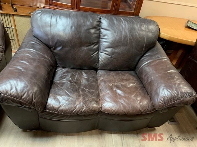 Dark brown couch. Brown leather couch. Dimensions: H- 38”, W- 60”, D- 40”