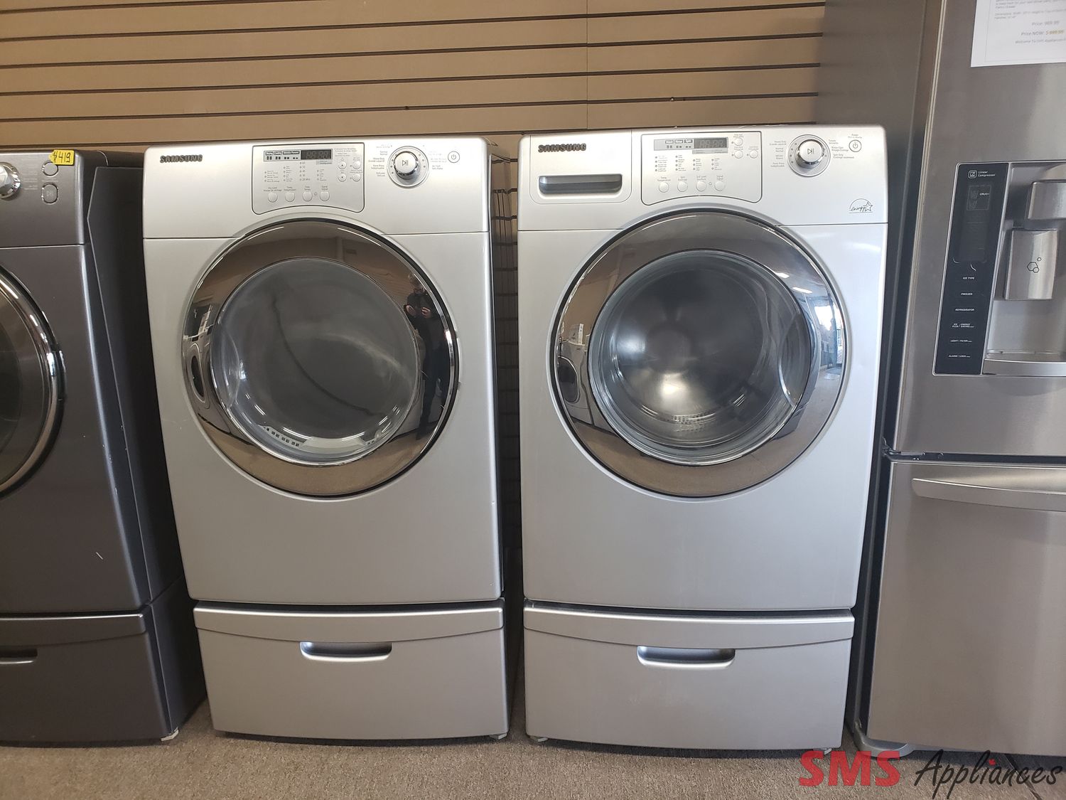 Samsung Washer and Dryer Set WF206ANS/DV206AES with a pedestal