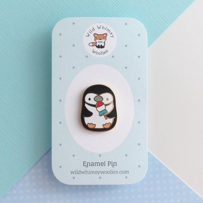 Penguin Holding Rocket Fish Ice Pop Enamel Pin