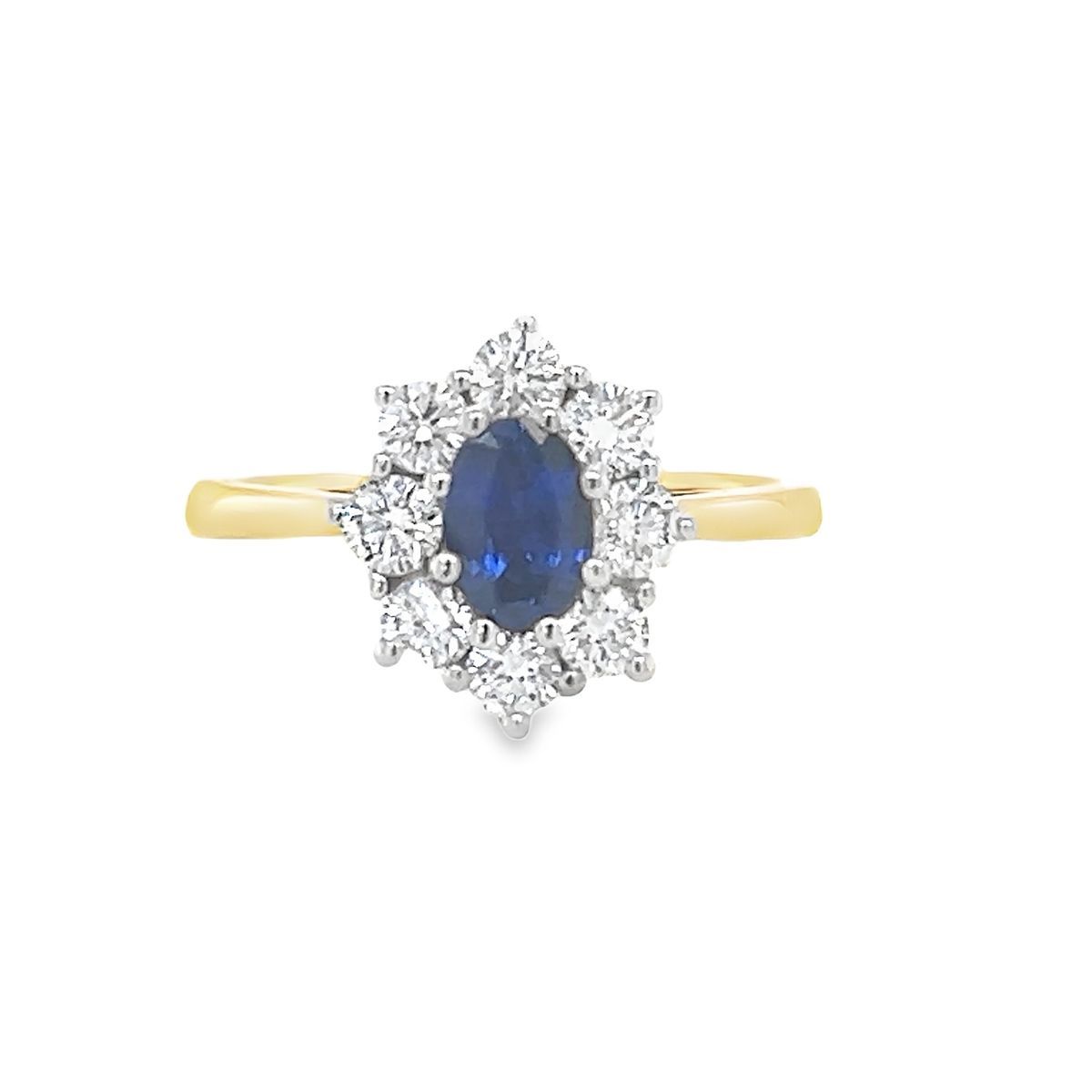 A Oval Sapphire and Diamond Cluster Ring 18 Carat Gold