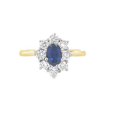 A Oval Sapphire and Diamond Cluster Ring 18 Carat Gold