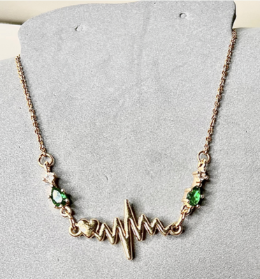 Gold plated and Emerald toned Crystal Heartbeat Necklace