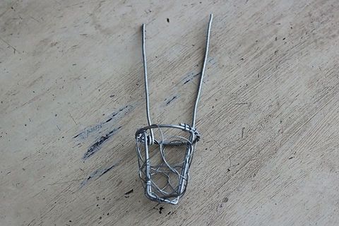 Climbing cement man,  wire basket