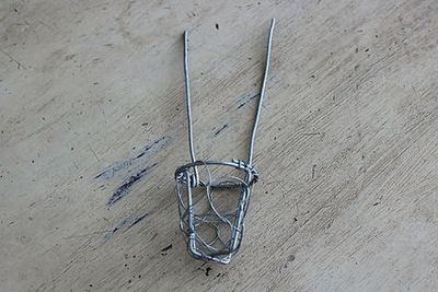 Climbing cement man, wire basket Climbing cement man, wire basket