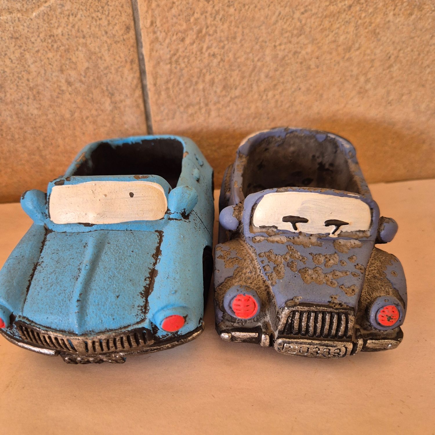 Vintage Tillandsia vehicle containers.