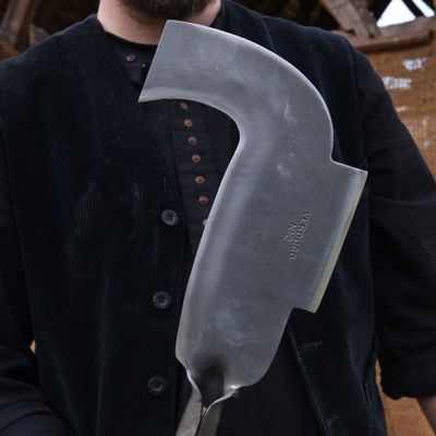 Grande serpe montée à double tranchant