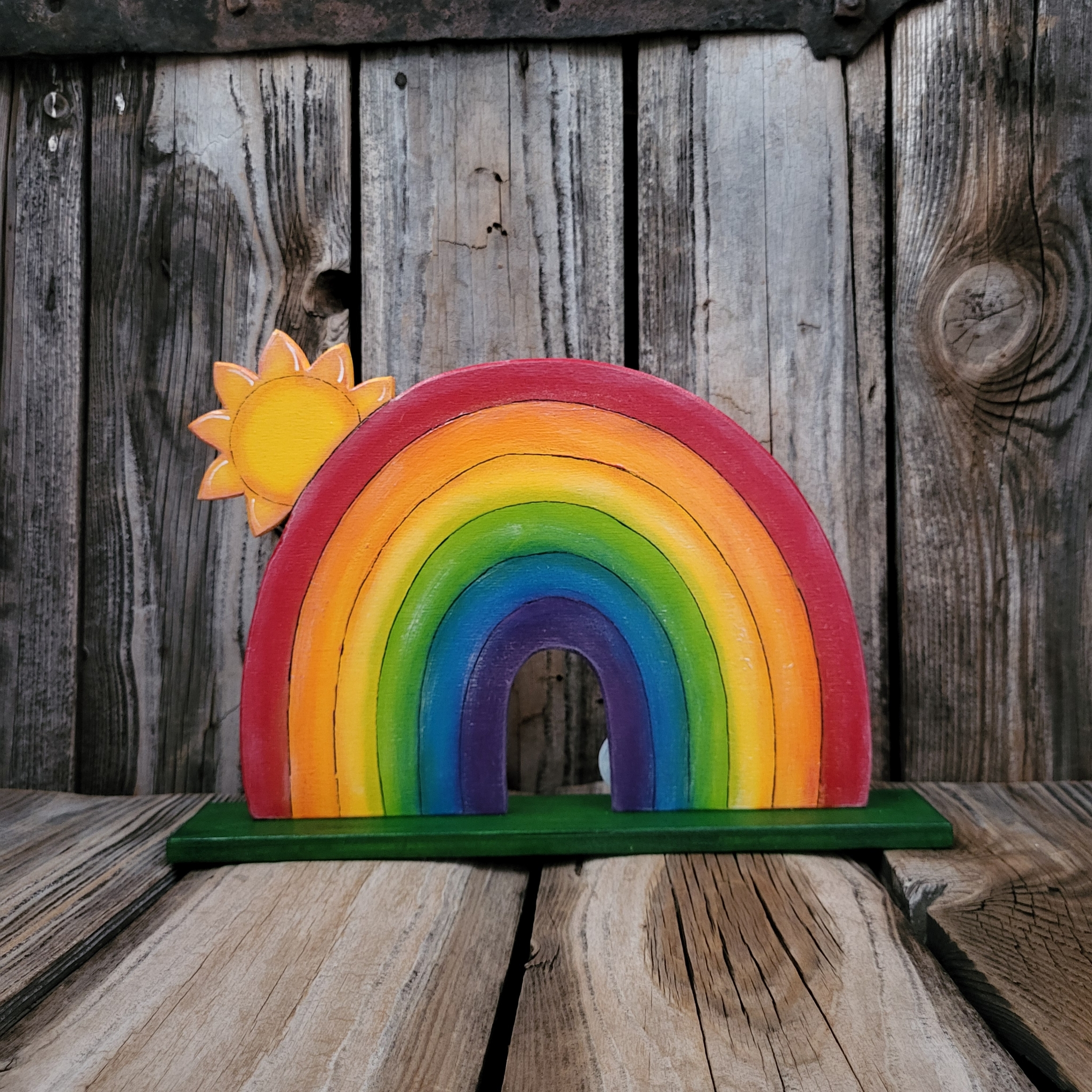 RegenBogen mit kleinem Sonnenschein