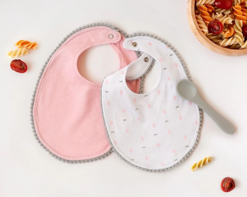 BABEROS BEBÉ KIOKIDS ROSA CONJUNTO DE DOS CON CUCHARA babero 