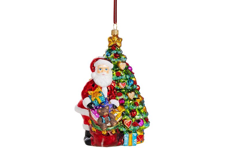 Kerstman pakt cadeautjes uit