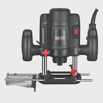 Black TEH electric plunge router with red accents, parallel fence guide, and depth adjustment scale, model TER7082, 1200W.