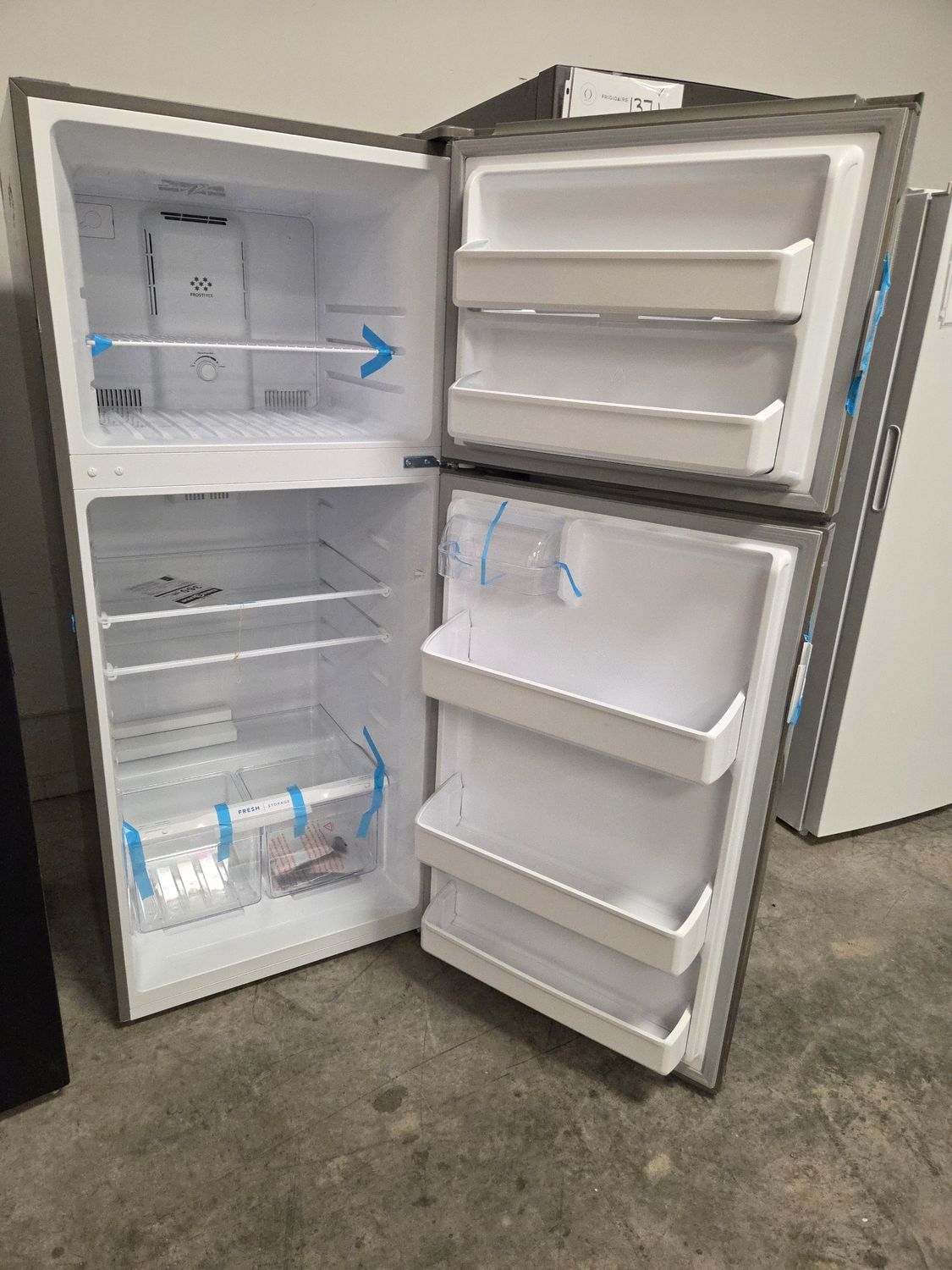 1351 FFHT1822UV Frigidaire® 28 in. 17.6 Cu. Ft. Brushed Steel Top Freezer Refrigerator