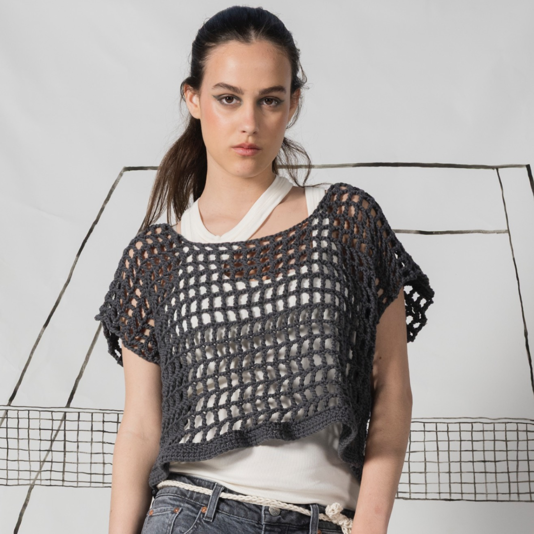 Dark hair girl wearing Crochet oversized  ladies' nettop in a chunky organic cotton. Color: charcoal