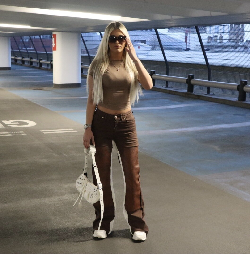 brown denim and leather jeans