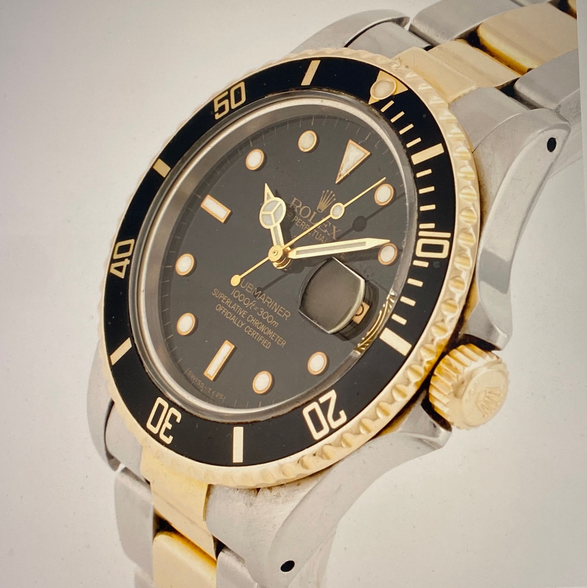 Rolex Submariner Stahl/Gold mit schwarzem Zifferblatt