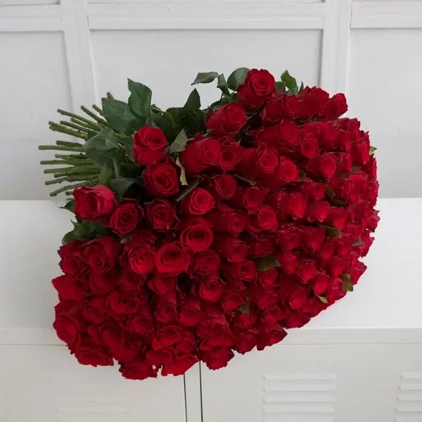 100 Dutch red roses are used in the bouquet.