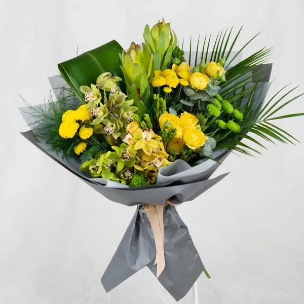 Bouquet with orchids in yellow-green tones