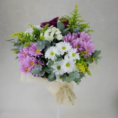 Colorful chrysanthemum and solidago are used in the bouquet.
