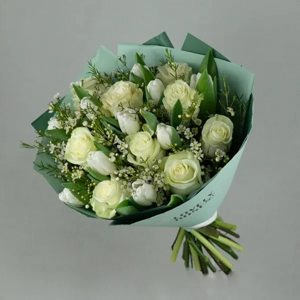 Delicate bouquet with roses and tulips