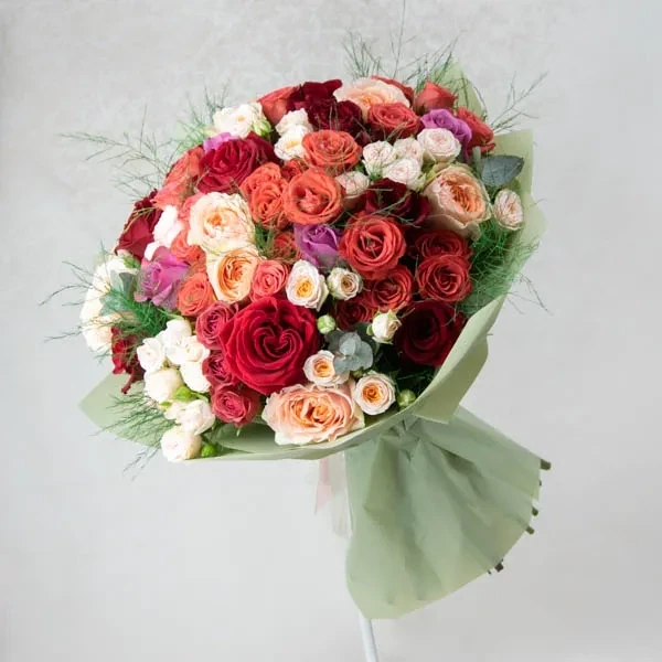 Mix bouquet with roses and asparagus