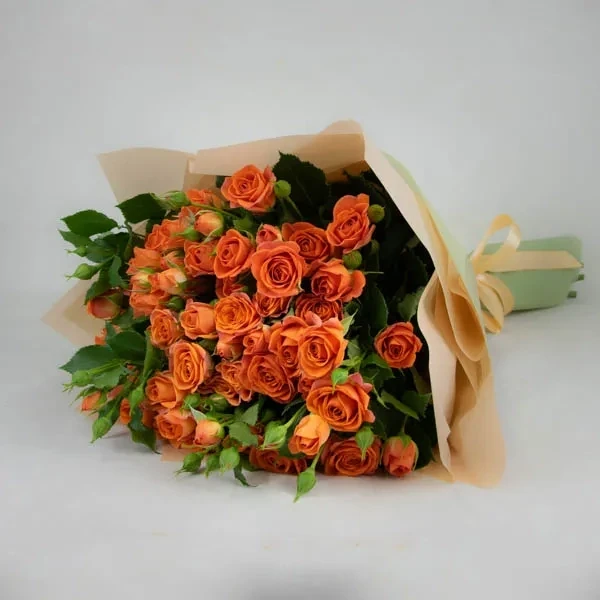 A bouquet of orange spray roses.