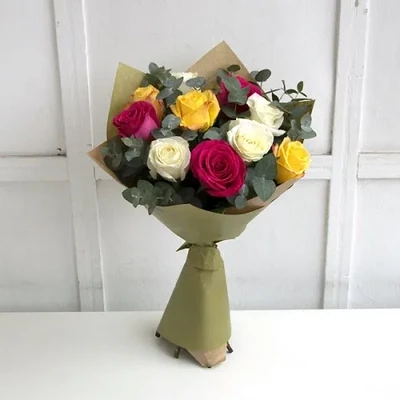 The bouquet is made of 10 roses and decorative greenery. The approximate size of the bouquet is 45-50 cm.