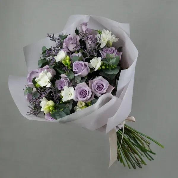 Bouquet with purple roses and freesias
