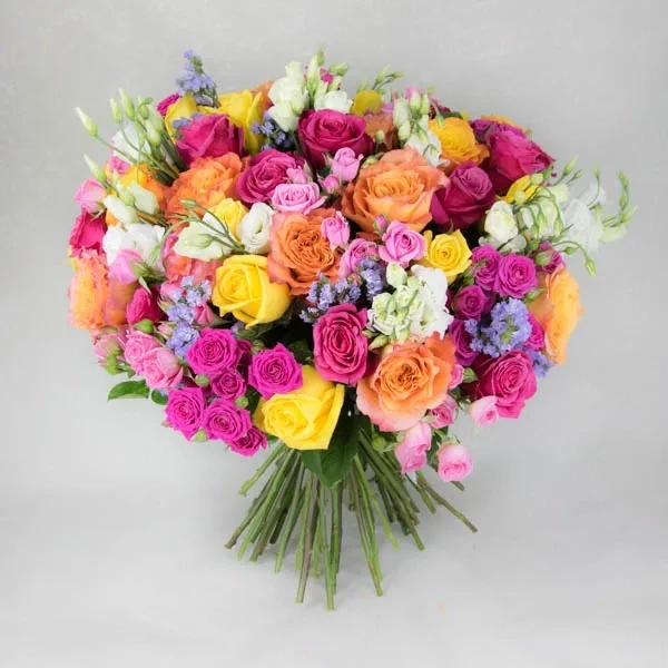 A beautiful bouquet made of bright, colorful roses and eustomas.