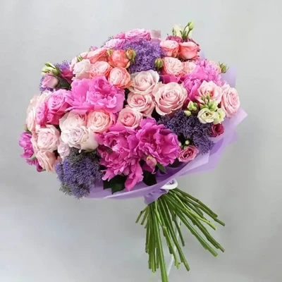 The bouquet is made of peonies and roses.