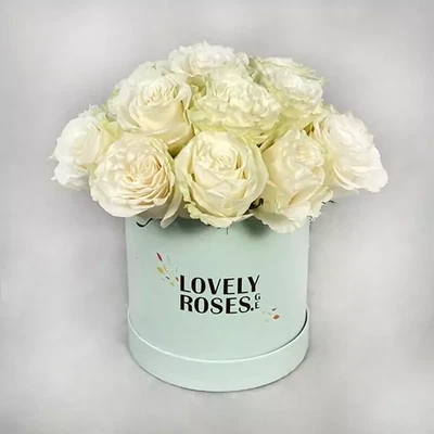 White roses in a mint box