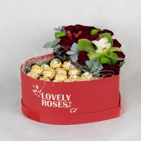 Mixed flowers in heart-shaped box