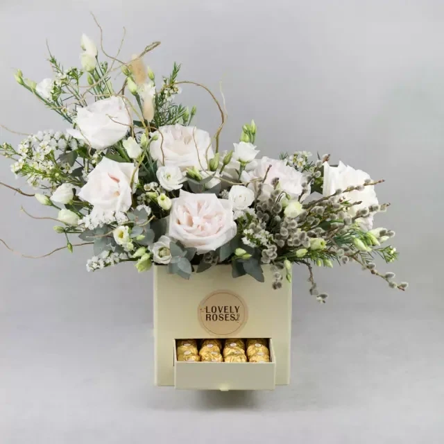 Composition of fragrant roses and Ferrero
